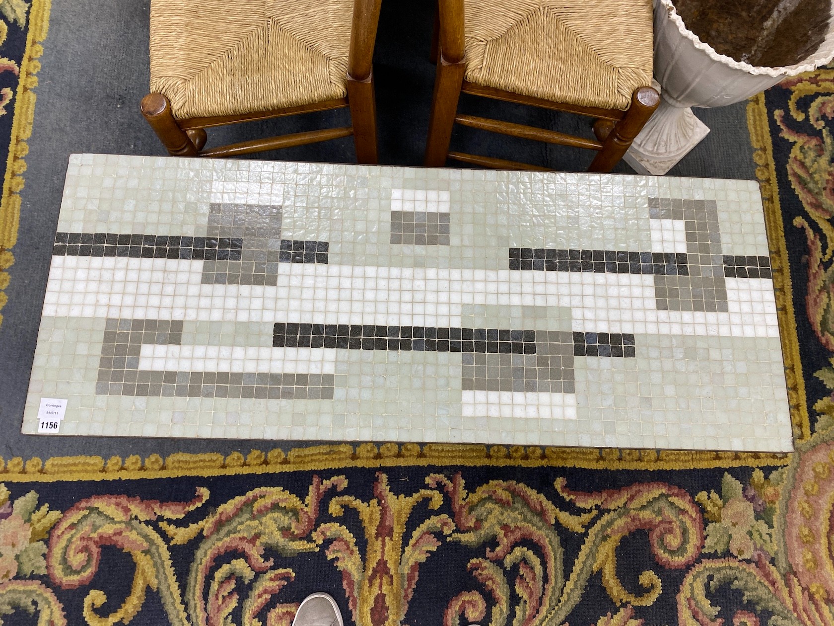 A 1950's wrought iron rectangular tiled top coffee table with geometric design, length 122cm, depth 48cm, height 43cm